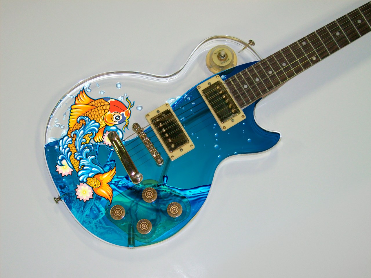 Custom printed electric guitar with coy fish and water graphic.